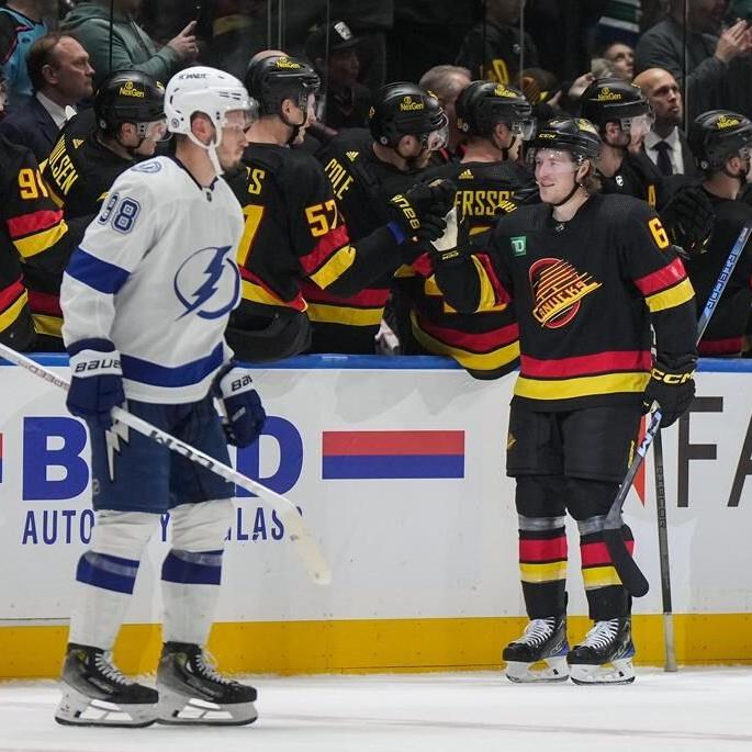 Boeser moves into tie for NHL scoring lead as Canucks beat Lightning 4-1